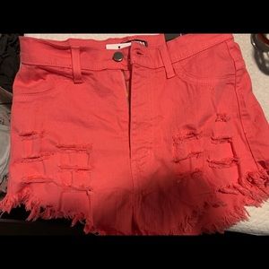 Pink denim distressed shorts